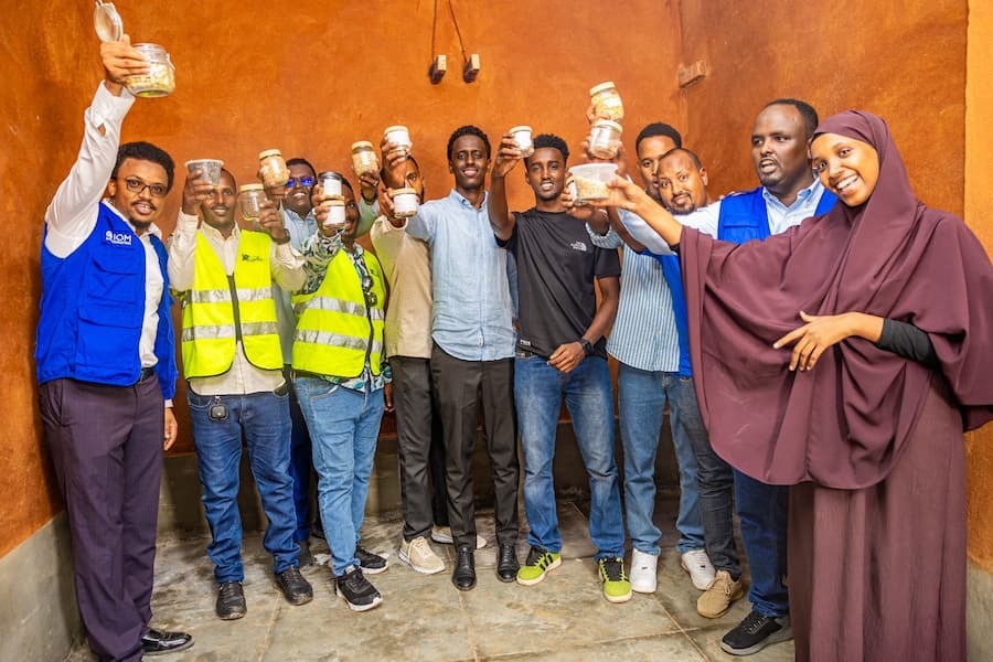 Group of people holding seeds