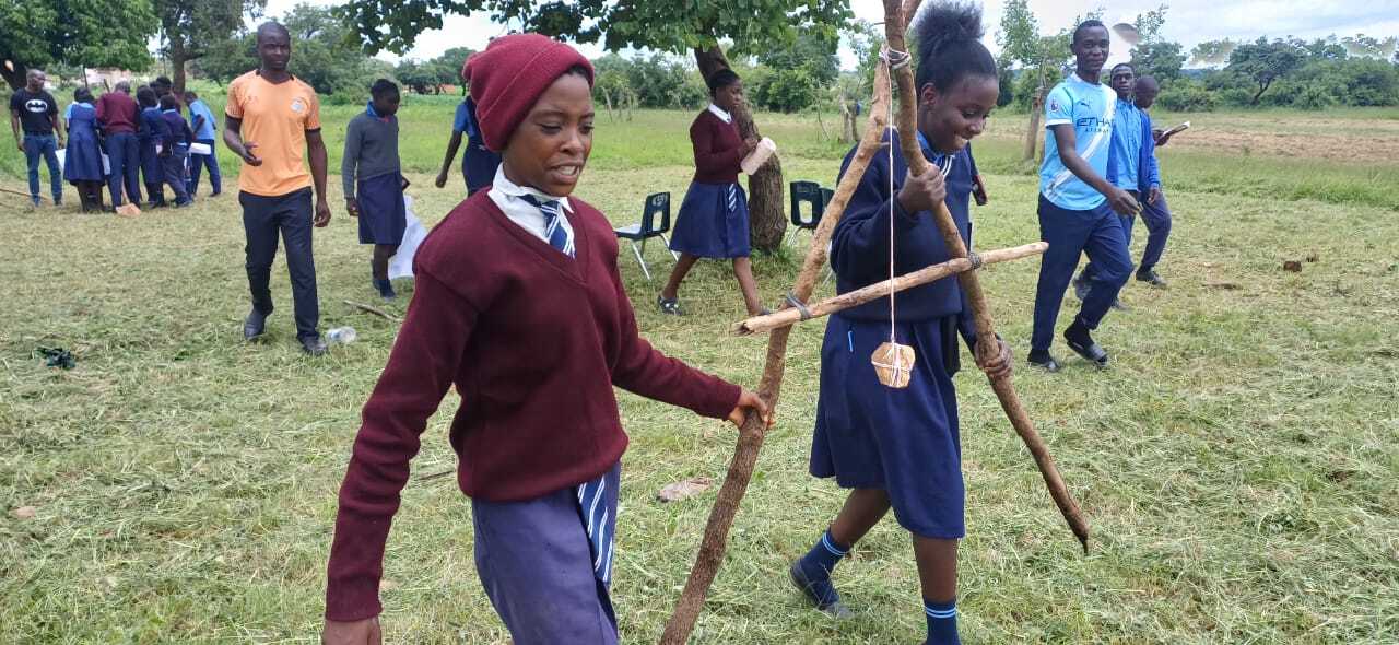 2 Students holding A-frame level